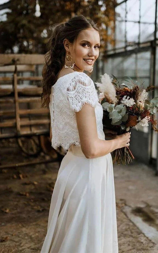 Vintage Boho Two-Piece Satin and Lace Wedding Dress with Bateau Neckline, Short Sleeves, Pleats, and Sweep Train