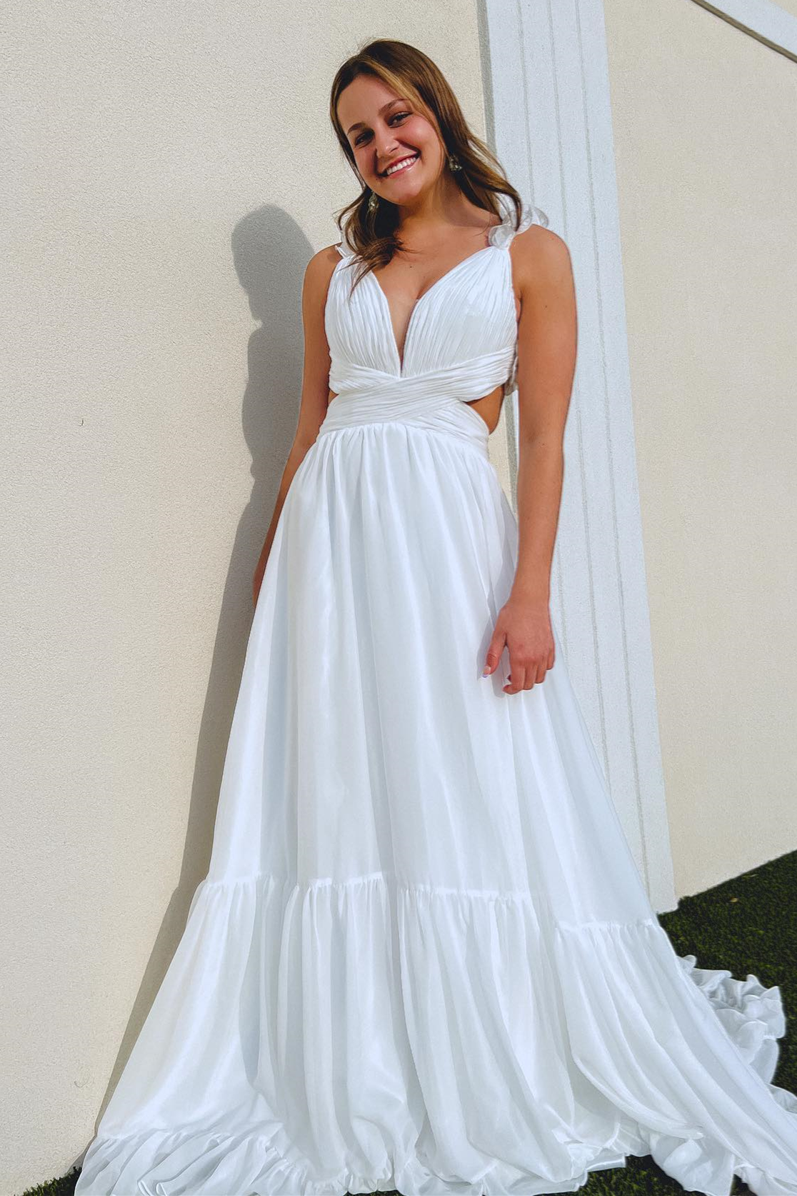 White A-Line Prom Dress with Ruffle Straps, Pleated Cut-Out, and Deep V Neck